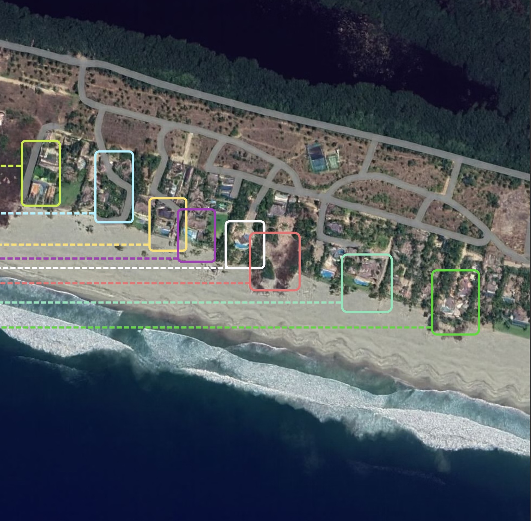 Aerial view of a beachfront villa cluster along the coast in Puerto Escondido