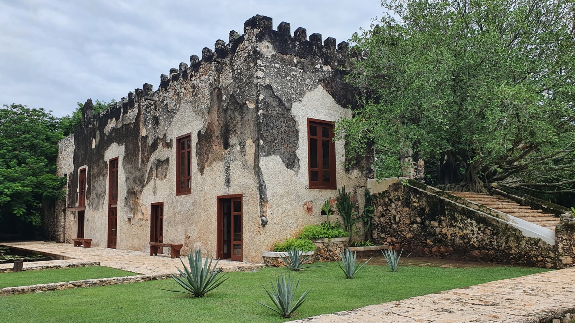 Weathered colonial hacienda facade and courtyard in Yucatán